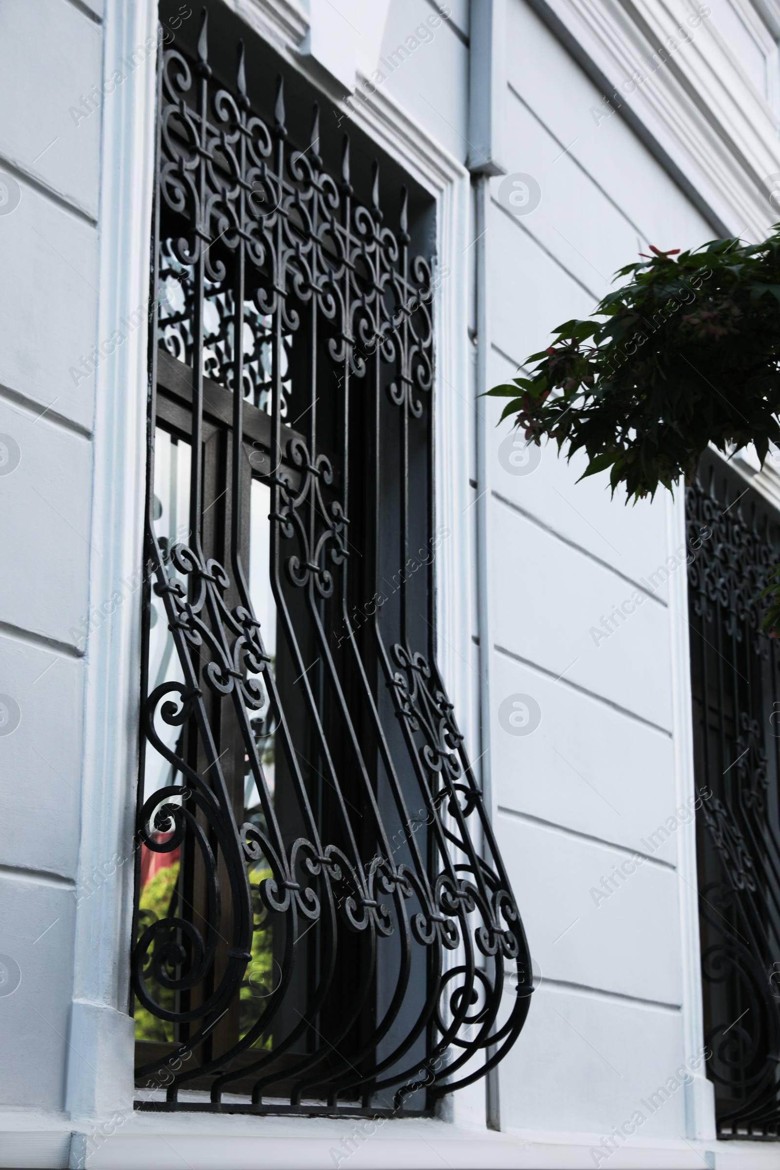 Photo of Beautiful window with grills in building outdoors