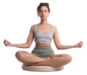 Photo of Beautiful African-American woman meditating on white background