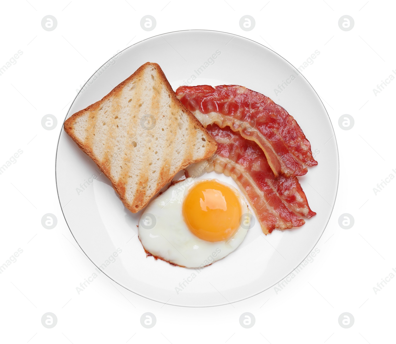 Photo of Plate with delicious fried egg, bacon and toast isolated on white, top view