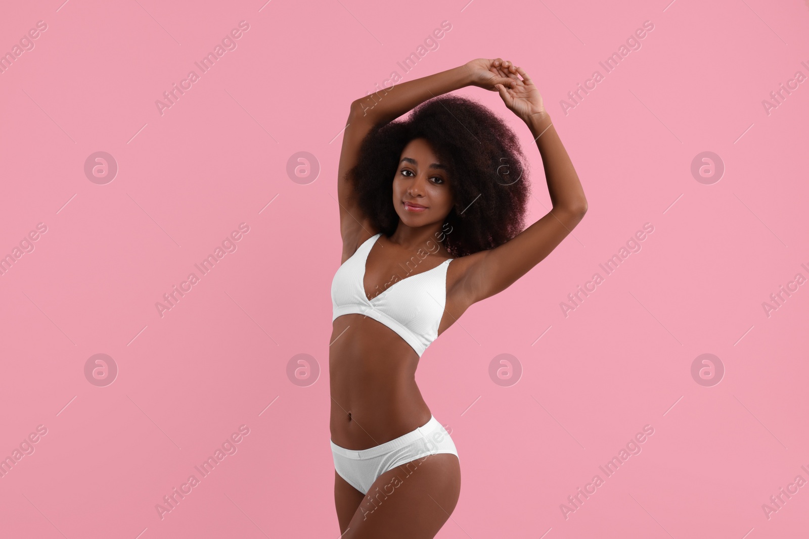 Photo of Beautiful woman in stylish bikini on pink background