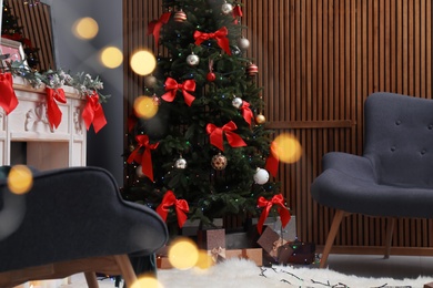 Photo of Stylish living room interior with decorated Christmas tree