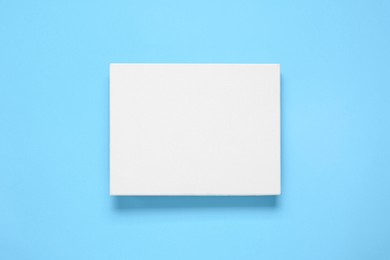 Blank canvas on light blue background, top view. Space for design