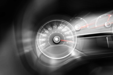 Image of Speedometer on dashboard in car, motion blur effect