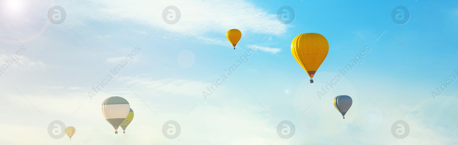 Image of Hot air balloons in blue sky. Banner design 