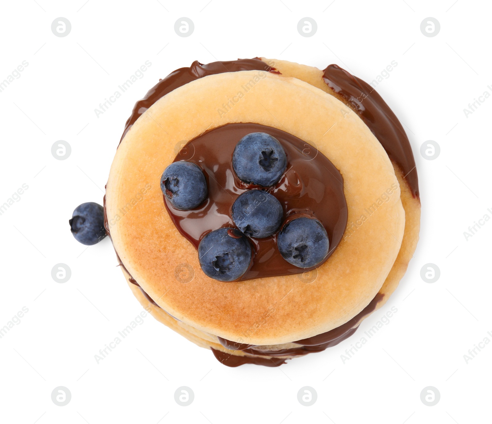 Photo of Tasty pancakes with chocolate spread and blueberries isolated on white, top view