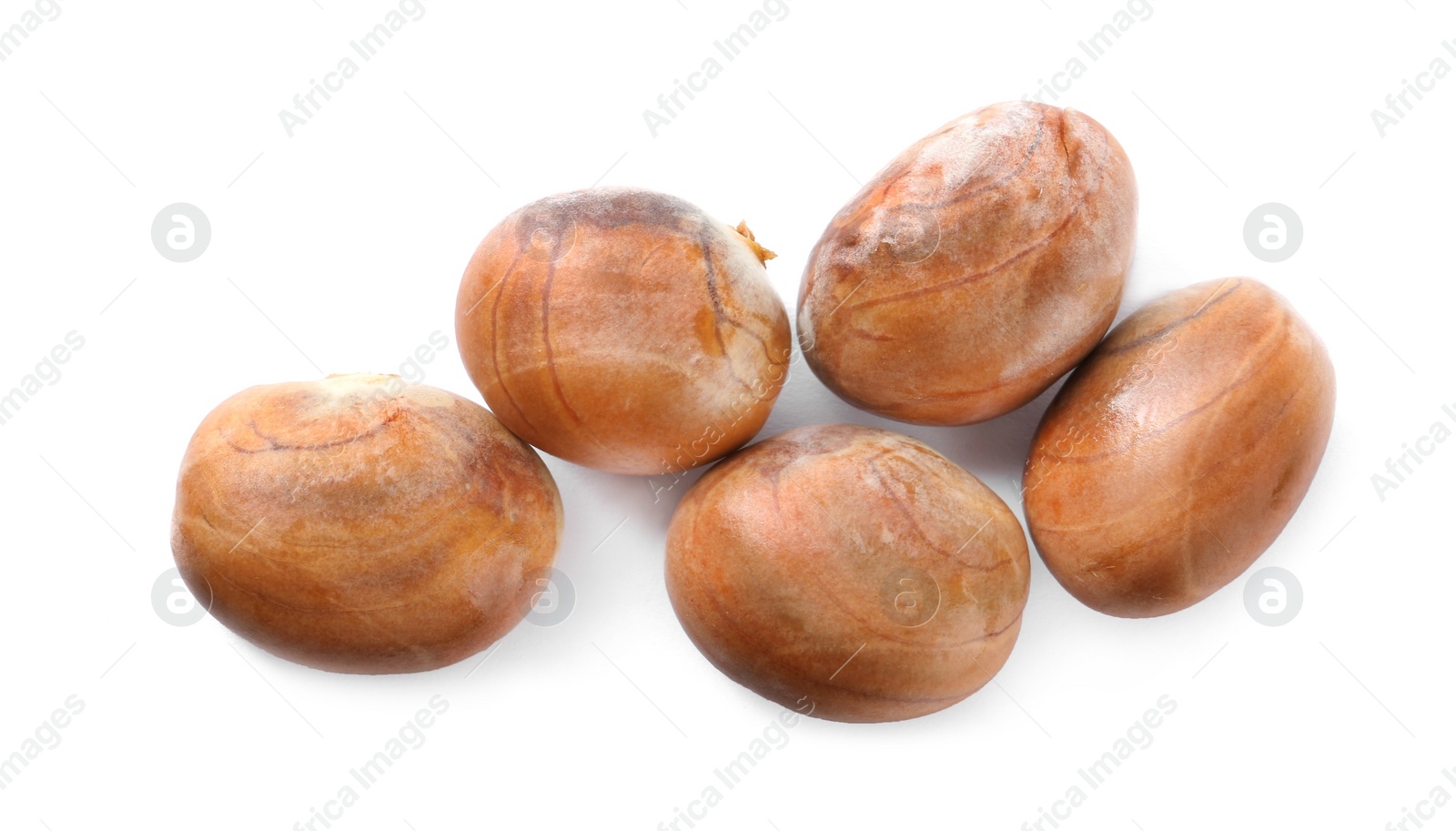 Photo of Many jackfruit seeds on white background, top view