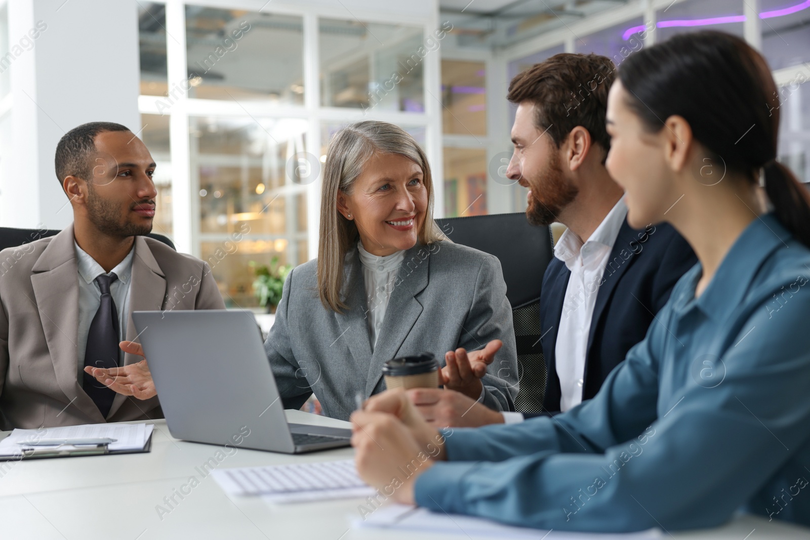 Photo of Lawyers working together at table in office