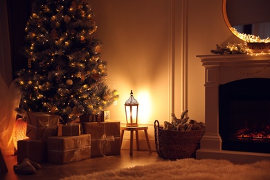 Photo of Beautiful room interior with Christmas tree and fireplace