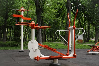 Photo of Empty outdoor gym with ovate stepper and push up bars