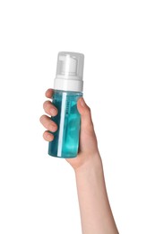 Photo of Woman holding bottle of face cleansing product on white background, closeup