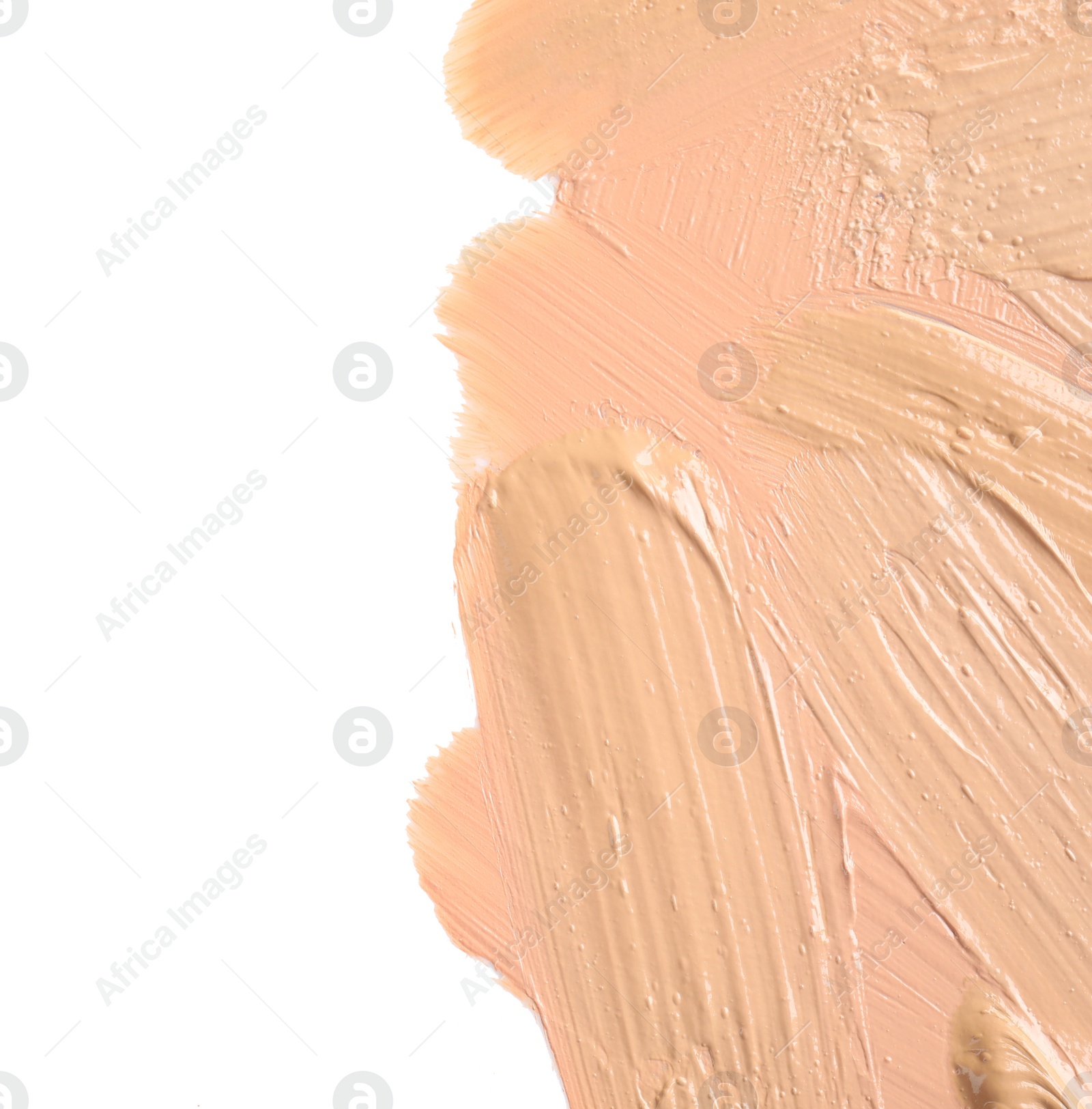 Photo of Samples of different foundation shades on white background, top view