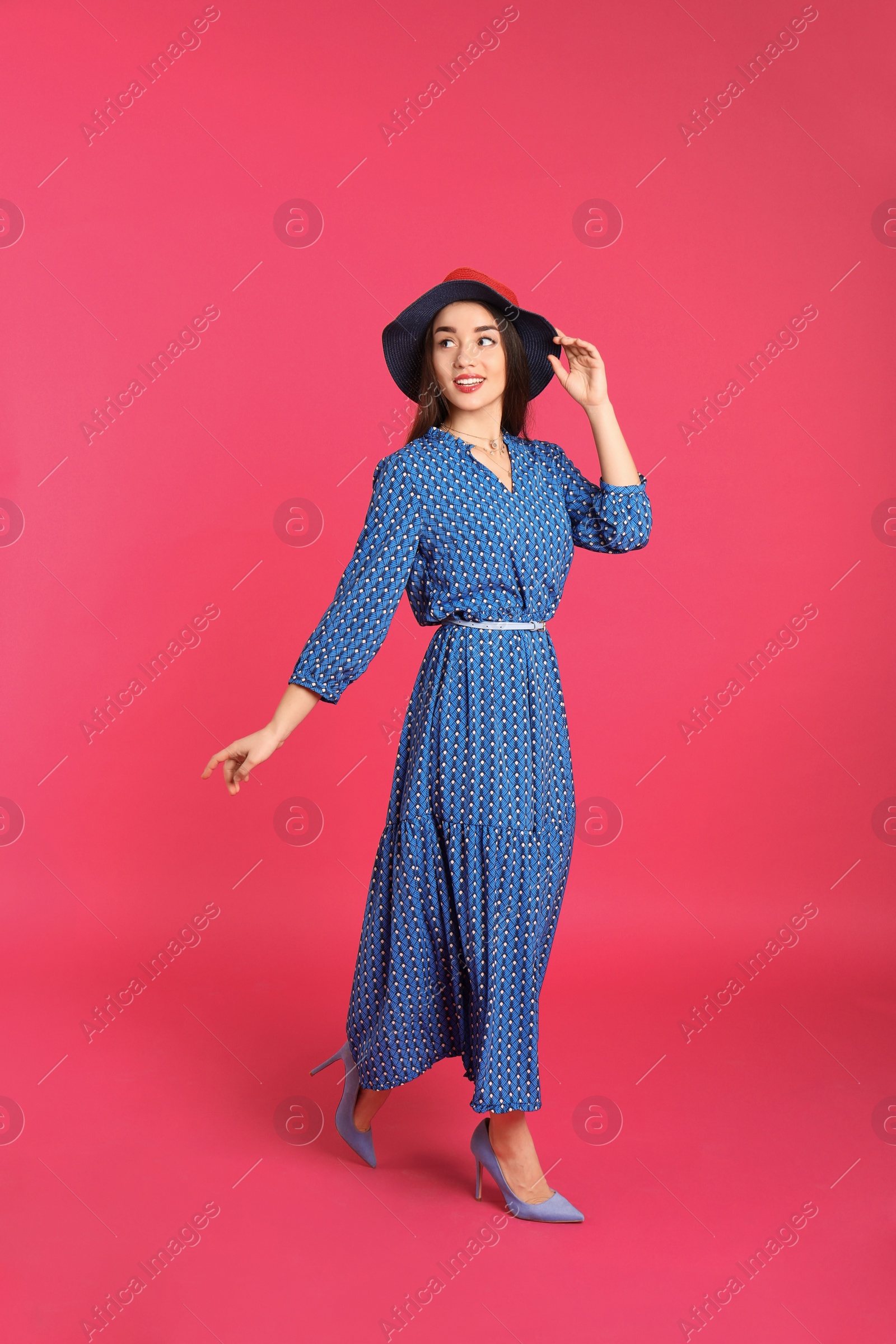 Photo of Portrait of beautiful young woman in stylish dress on color background