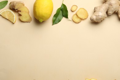 Fresh lemons and ginger on beige background, flat lay. Space for text