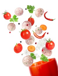 Image of Stuffed pepper recipe. Fresh ingredients falling into bell pepper on white background