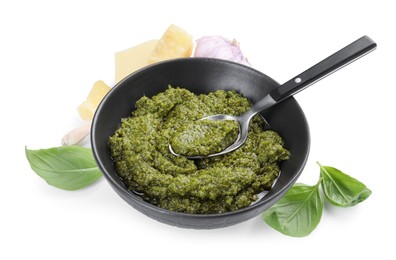 Photo of Fresh tasty pesto sauce and ingredients isolated on white