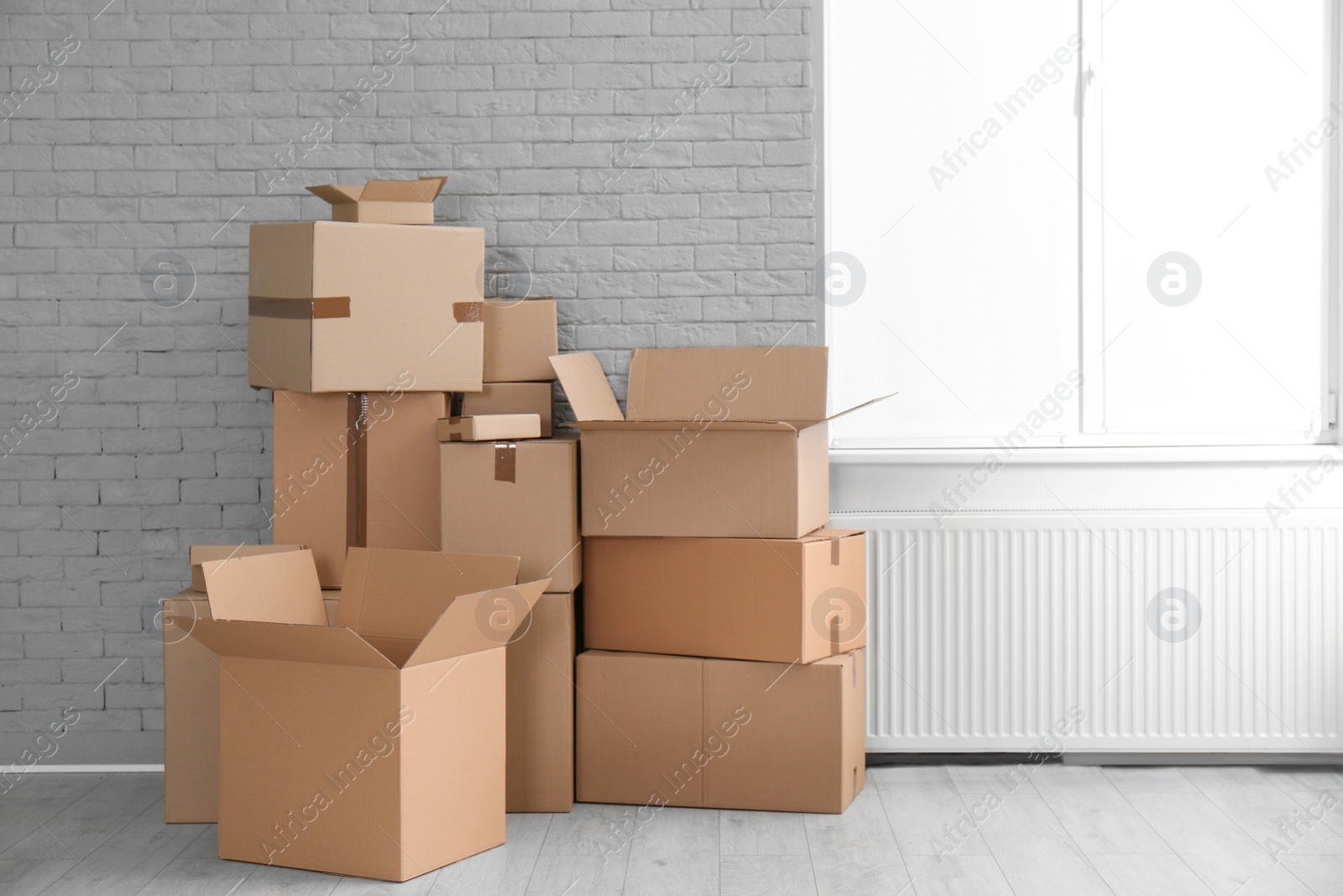 Photo of Cardboard boxes on floor indoors