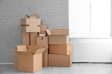 Photo of Cardboard boxes on floor indoors