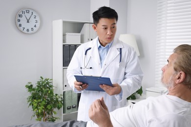 Photo of Senior patient having appointment with doctor in clinic