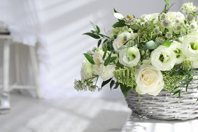 Photo of Basket with beautiful wedding flowers on window sill indoors, closeup