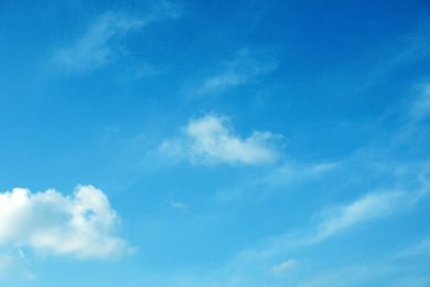 Photo of Beautiful light blue sky with fluffy clouds