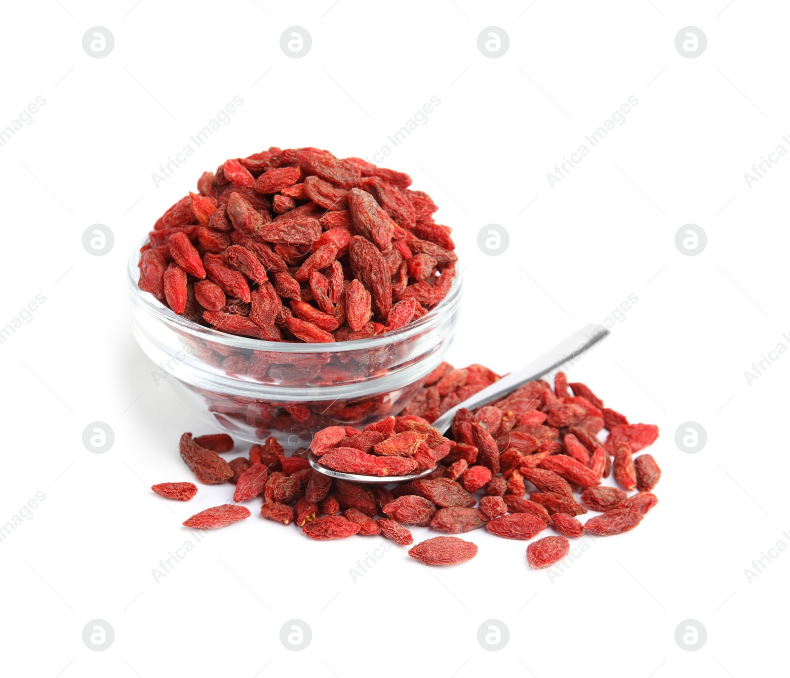 Photo of Glass bowl and spoon with dried goji berries on white background