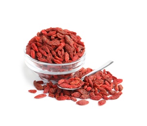 Photo of Glass bowl and spoon with dried goji berries on white background