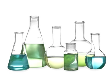 Photo of Glassware with liquids isolated on white. Laboratory analysis