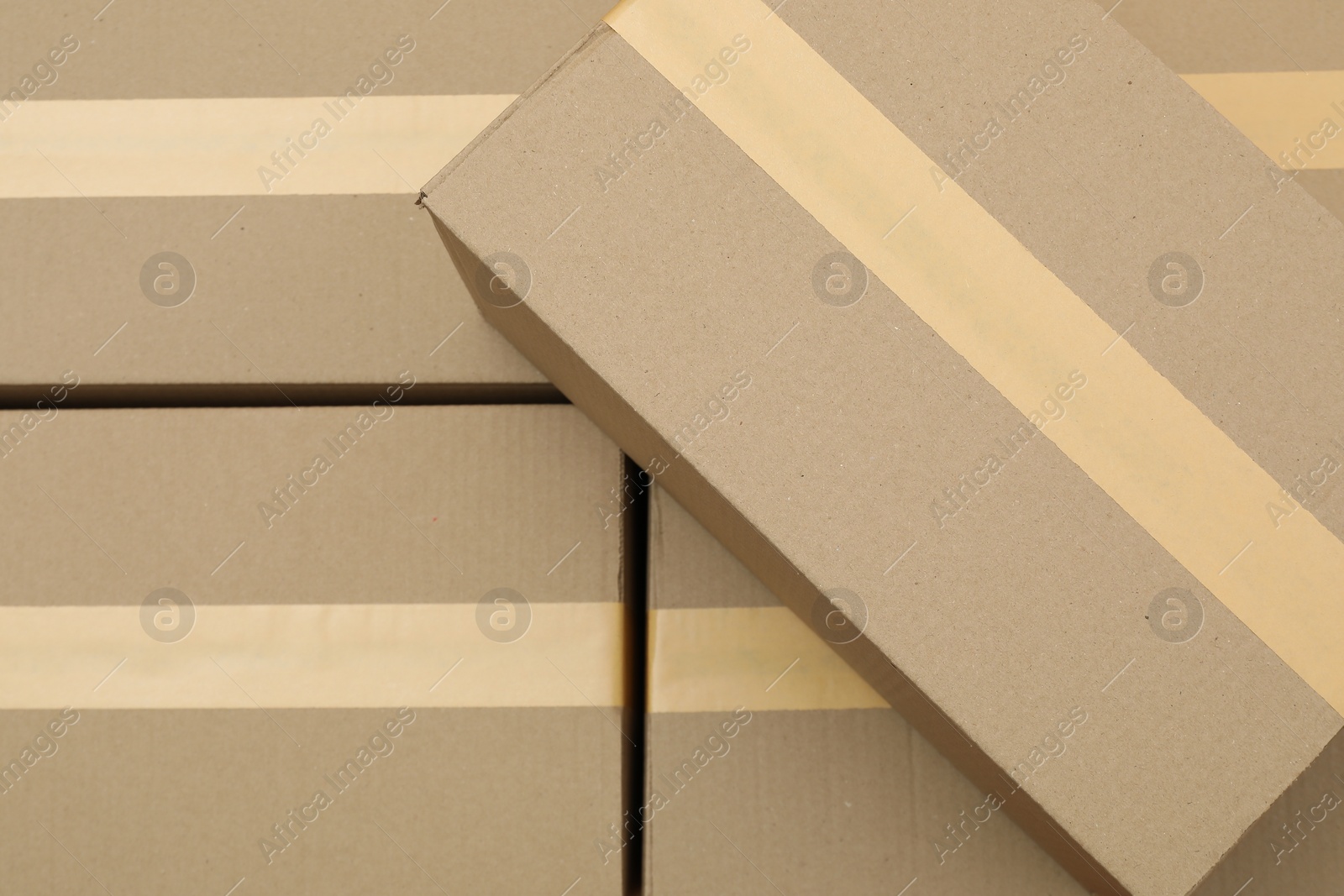 Photo of Many cardboard boxes as background, top view