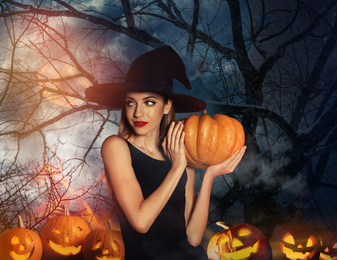 Witch with pumpkin and misty forest under full moon on Halloween