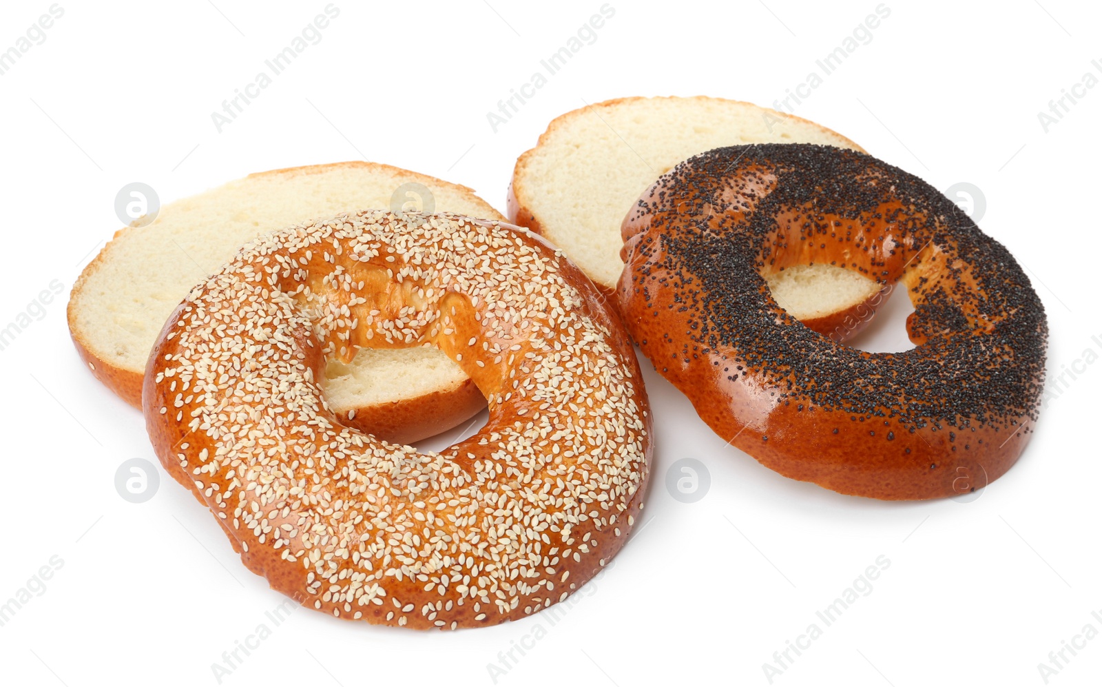 Photo of Delicious fresh halved bagels isolated on white