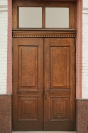 Photo of Building with vintage wooden door. Exterior design