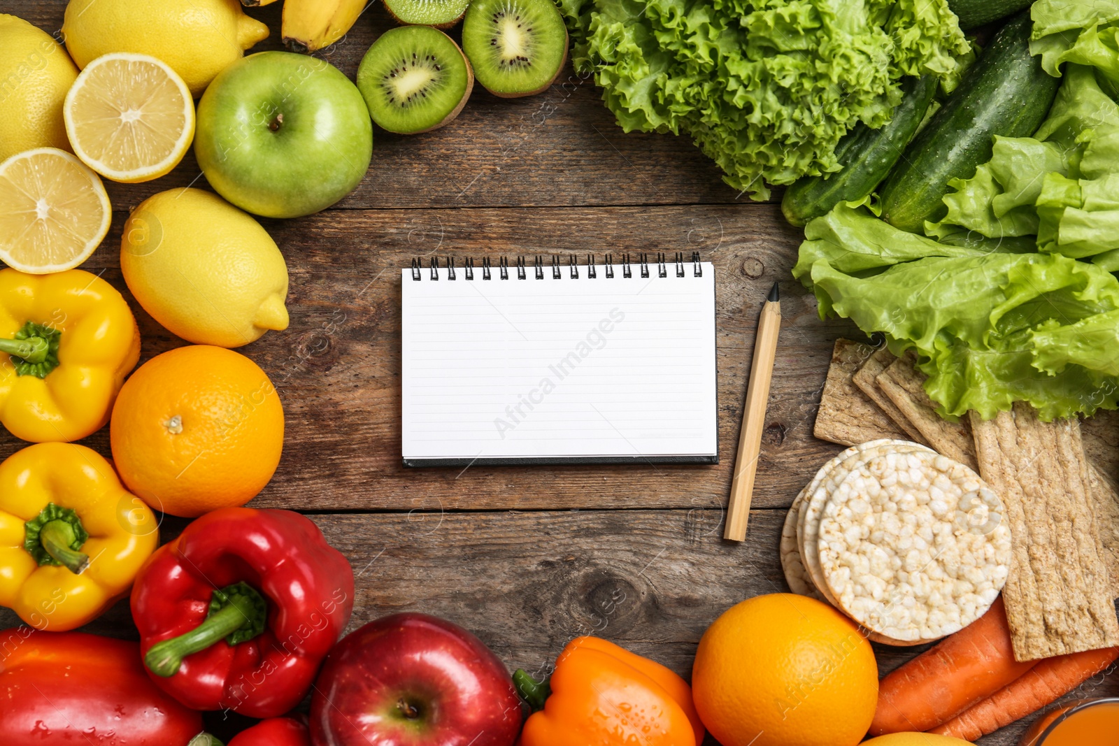 Photo of Flat lay composition with healthy food and space for text on wooden background. Concept of weight loss