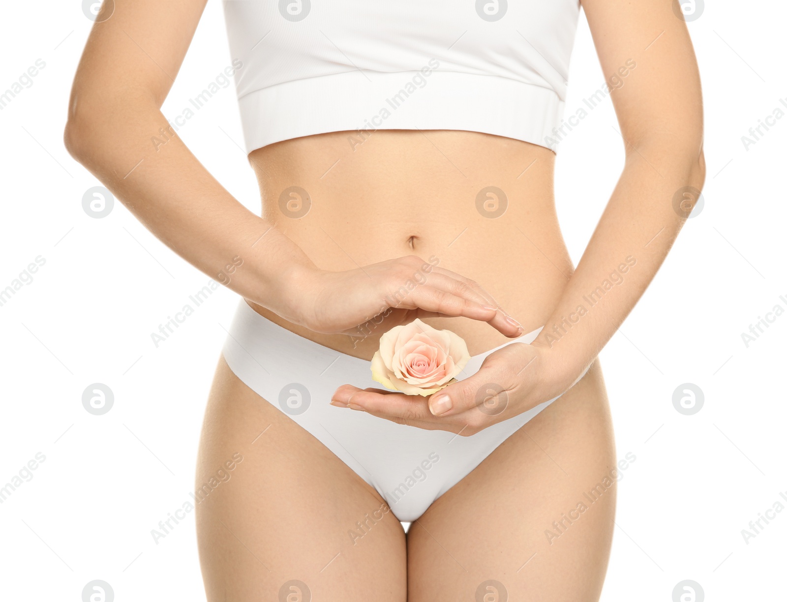 Photo of Gynecology. Woman in underwear with rose flower on white background, closeup