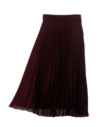 Stylish pleated skirt on mannequin against white background. Women's clothes