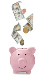 Image of Banknotes and coins falling into piggy bank on white background. Saving money