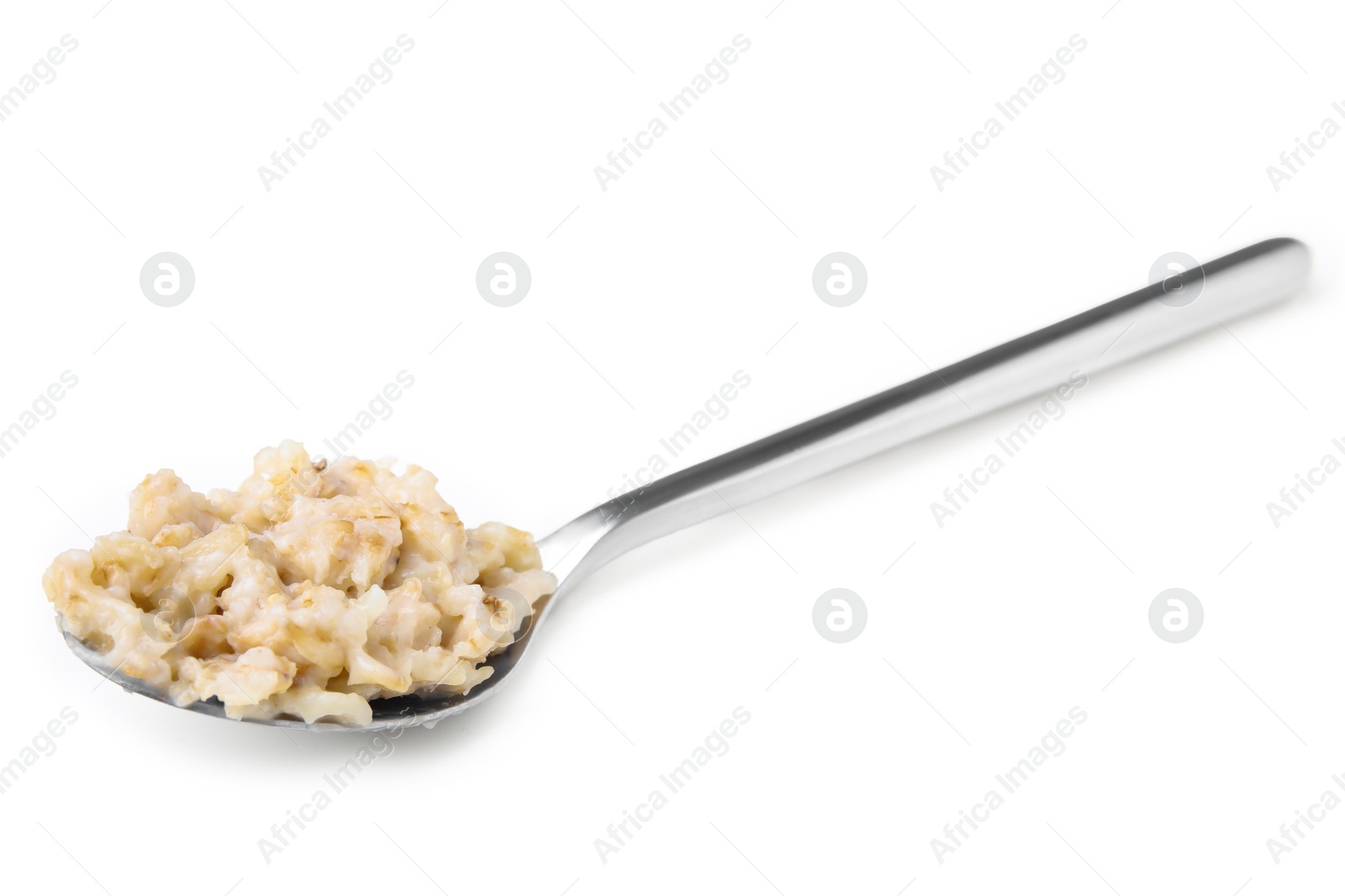 Photo of Metal spoon with oatmeal isolated on white