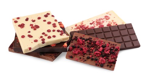 Chocolate bars with freeze dried berries on white background