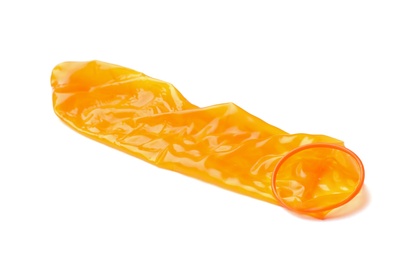 Photo of Orange used condom on white background. Safe sex concept