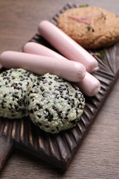 Photo of Different vegan products on wooden table, closeup