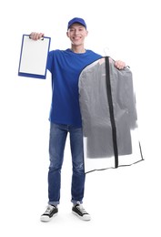 Dry-cleaning delivery. Happy courier holding garment cover with clothes and clipboard on white background