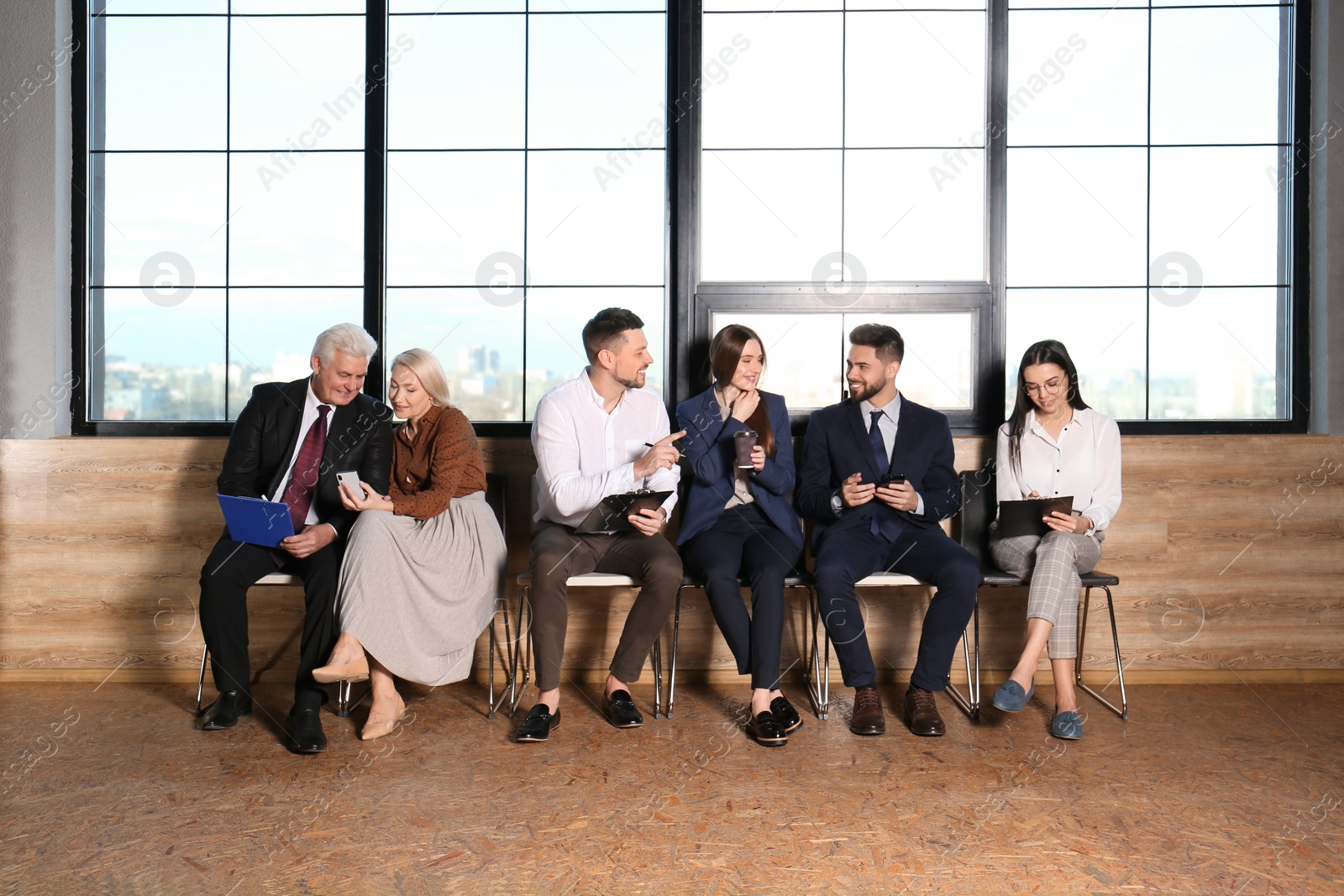 Photo of People waiting for job interview in office hall