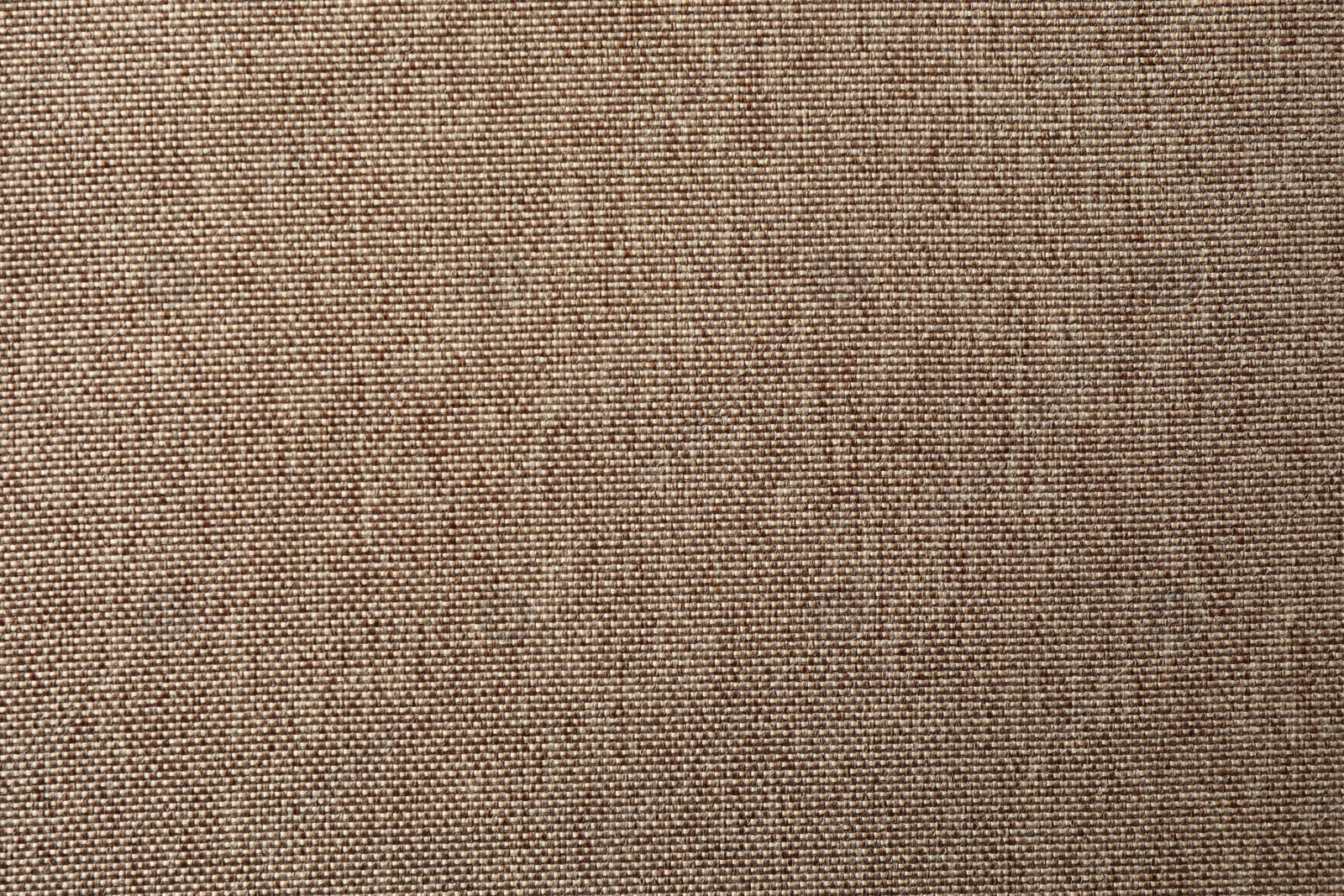 Photo of Texture of brown fabric as background, top view