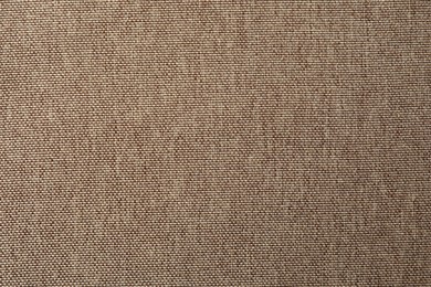 Photo of Texture of brown fabric as background, top view