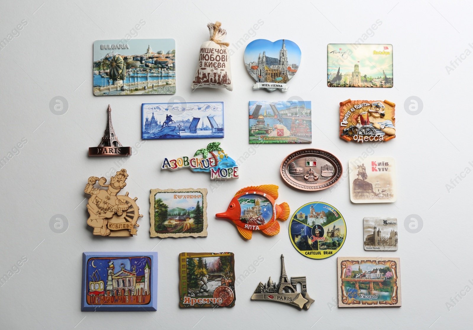 Photo of MYKOLAIV, UKRAINE - DECEMBER 24, 2018: Many different travel magnets on light background