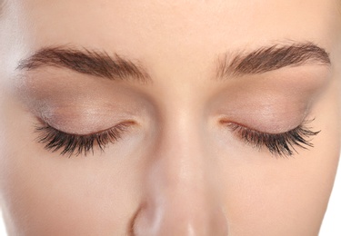 Young woman with beautiful natural eyelashes, closeup view