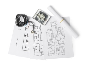 Wiring diagrams, wires and disassembled light switch isolated on white, top view