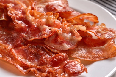 Plate with fried bacon, closeup