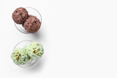 Delicious chocolate and pistachio ice creams on white background, flat lay