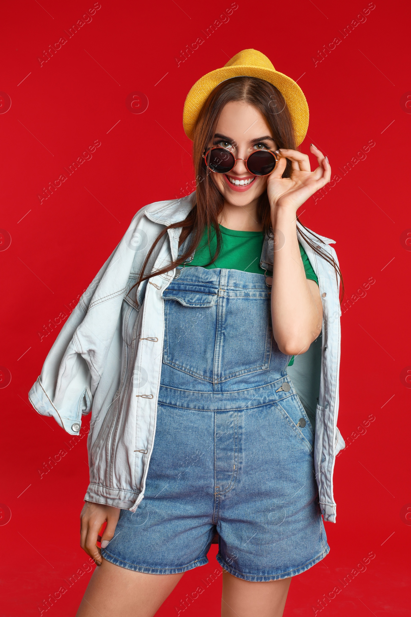 Photo of Portrait of beautiful woman on red background