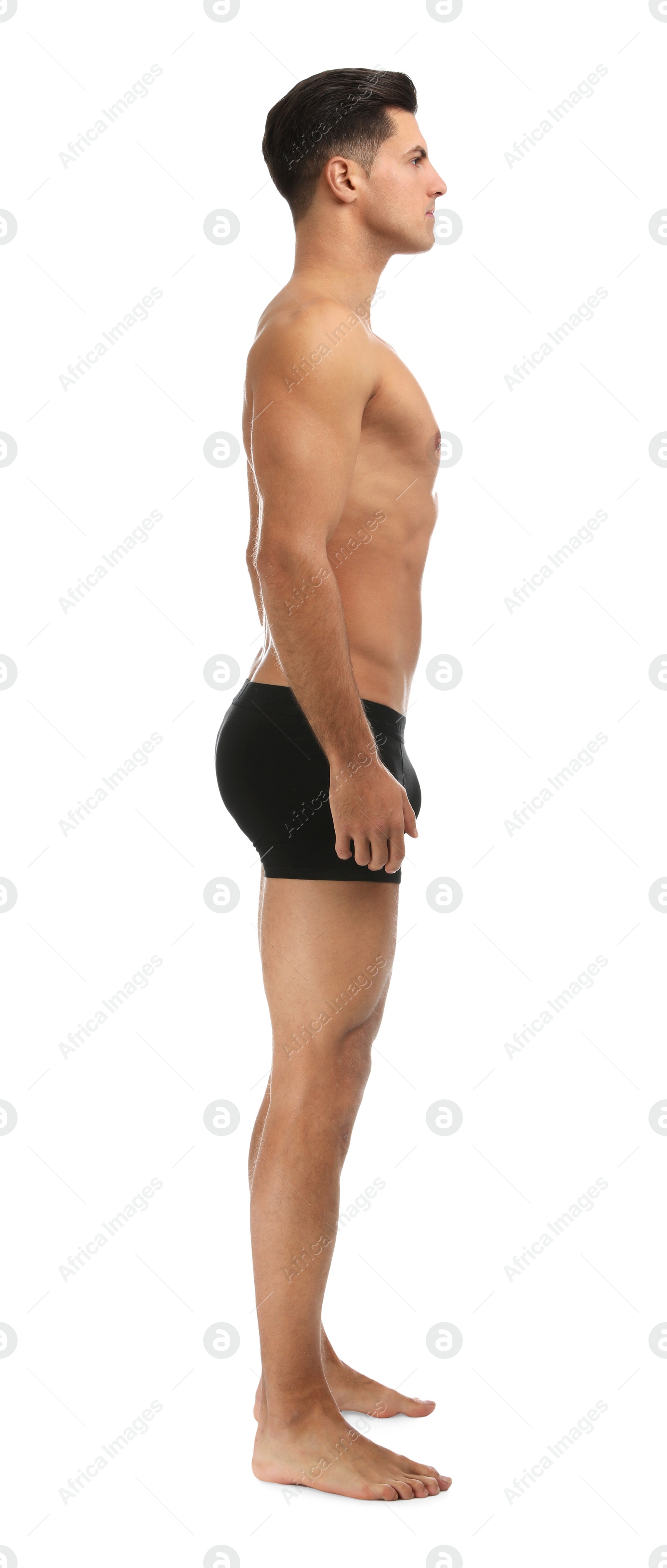 Photo of Handsome man in black underwear on white background